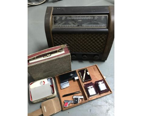 A Lot of vintage collectables which includes G &amp; C Valve radio, Car portable radio, Vintage lighters which includes Ronso