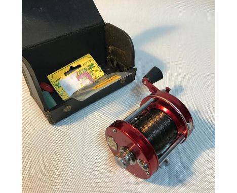 A vintage Abu Ambassadeur 6000 Multiplier reel with case. 