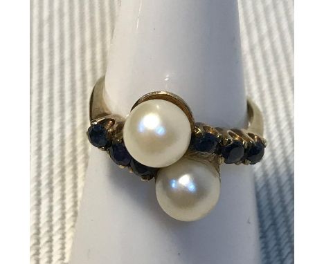 A ladies 9ct gold double pearl and 6 sapphire stone ring . Ring size L. Weighs 3grams 