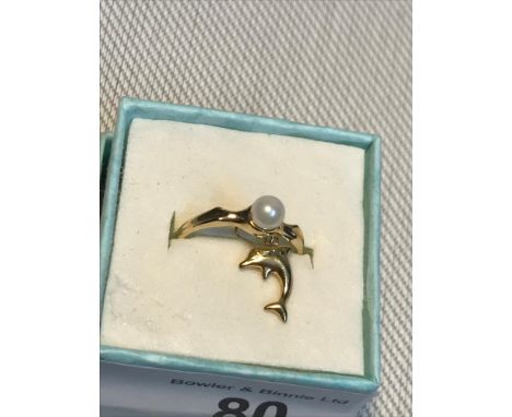A Ladies 10ct gold ring set with a single pearl together with an 18ct gold dolphin pendant. 
