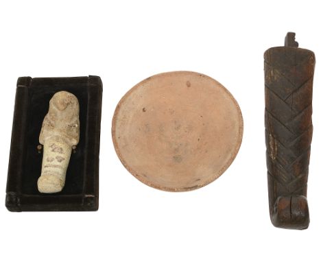 Antiquities. An Egyptian polychromed wooden plaited false beard, a carved and painted limestone shabti and a pottery bowl, (3
