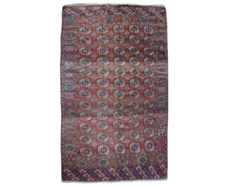 A Tekke Bokhara carpet, Turkmenistan early 20th centurythe madder field with with five rows of twelve guls, subsidiary enclos