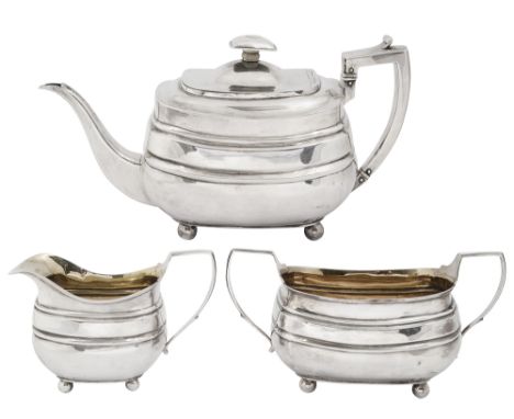 A George III silver three piece tea serviceLondon, 1806 by Alice &amp; George Burrowsof oblong bellied form on ball feet, com