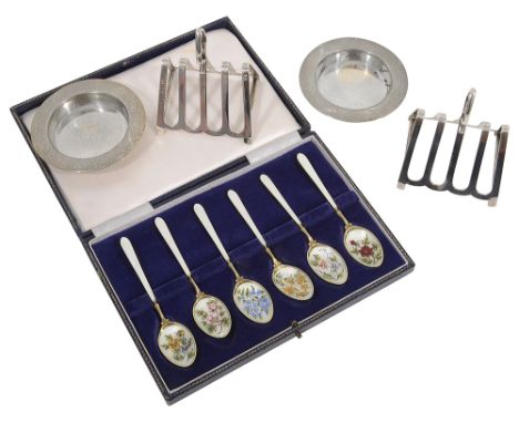 A pair of George V Asprey silver toast racks and a pair of pin dishes together with a cased set of six silver gilt and painte