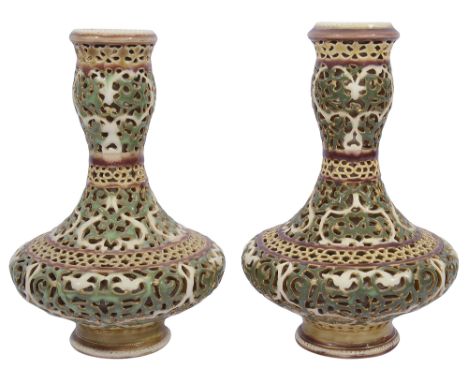 A pair of Zsolnay double walled reticulated porcelain vases c.1900of bottle form, impressed 2710 Zsolnay Pecs, factory mark i