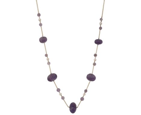 A carved amethyst and cultured pearl long chain necklace, the trace link chain suspending  five graduated ridged compressed m