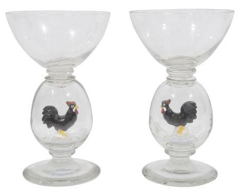 A pair of novelty wine glasses in the style of Williams and Stevens C.1930each with wide circular tapering bowls on large hol