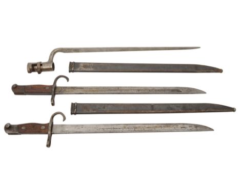 A triangular socket bayonet and two Japanese Type 30 bayonets and scabbardsfirst possibly Russian, bears arsenal mark crowed 
