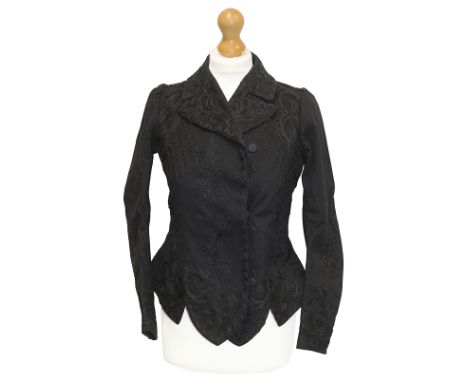 A collection of Victorian ladies clothing, including: a black ladies jacket, embroidered with braid; a full length silk skirt