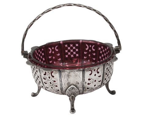 An early Victorian silver swing handled sugar basket Sheffield, 1854 by Henry Wilkinson &amp; Co.,of circular lobed design wi