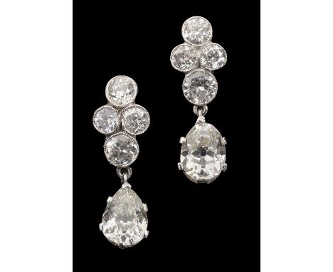 A pair of diamond pendant earringseach with a four stone brilliant cut diamond cluster surmount suspending a pear-shaped old 