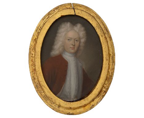 18th century British School 'portrait miniature of a gentleman, wearing a full wig and red coat', oil on copper, oval, gilt g