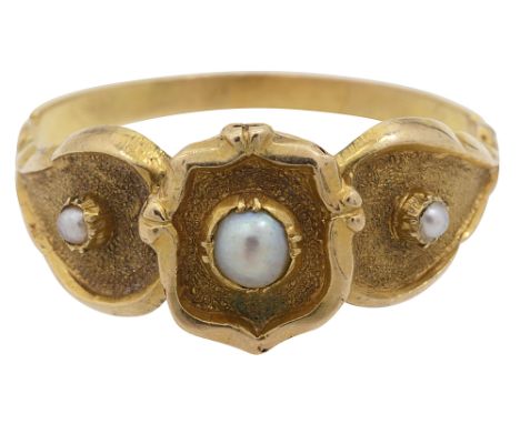 A 19th century pearl and yellow gold ring,  the three half pearls collet-set above the  three textured shaped plaques with po