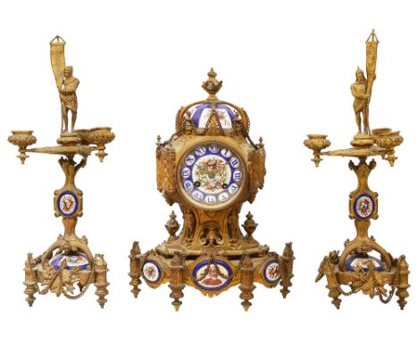 A mid 19th century French Gothic Revival ormolu and painted porcelain three piece clock garniturethe eight day movement stamp