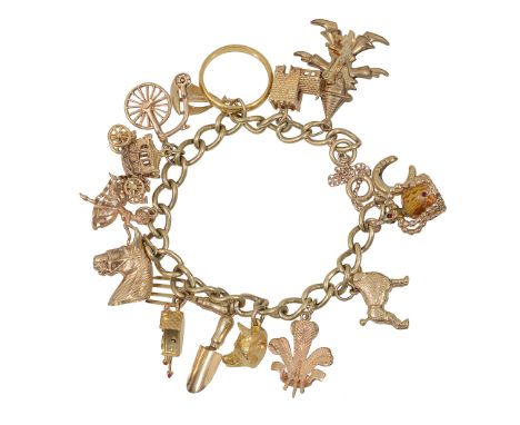 A 9ct gold charm bracelet with a number of charms mostly marked 9ct including cuckoo clock, shovel and fork, horse etc. and a