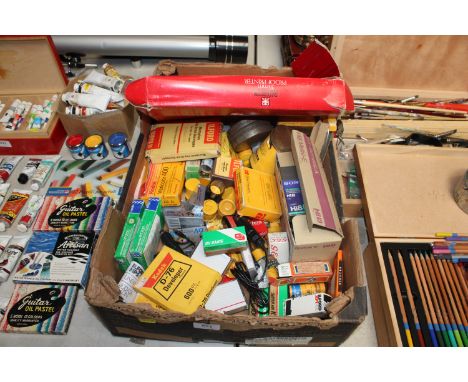 A box containing Kodak developer powder, various camera film and various other camera accessories