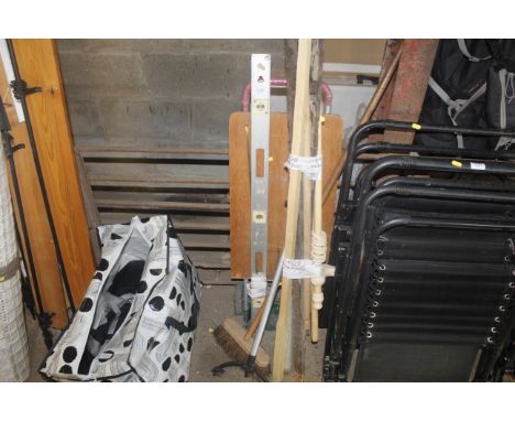 A spirit level, various brooms, folding sack barrow, mop, various lengths of timber etc.
