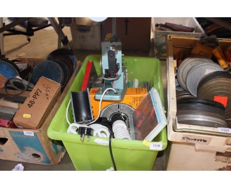 A box containing various film reels, Kodak carousel, light fittings etc.