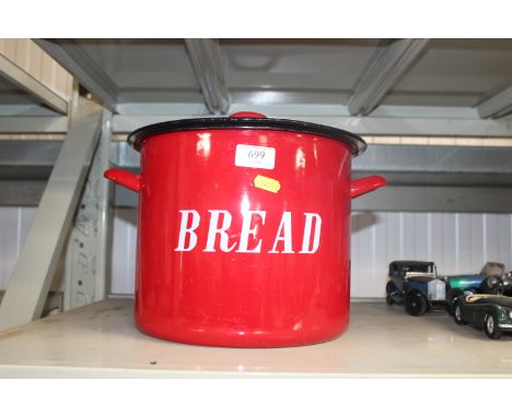 A red enamel bread bin 