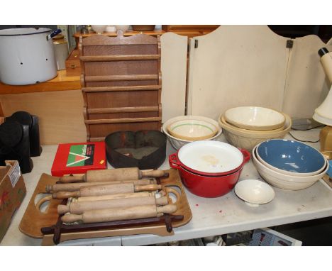 A collection of various kitchenalia to include mixing bowls, spice rack, rolling pins etc.