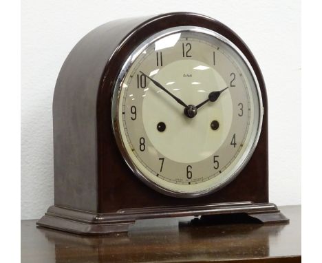 Art Deco Enfield mantel clock, arched top Bakelite case with Arabic dial, twin train movement striking the half hours on a co