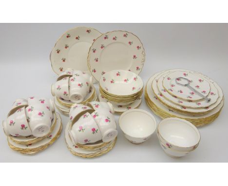 Colclough dinner and tea service, decorated with sprig of roses on plain ground 