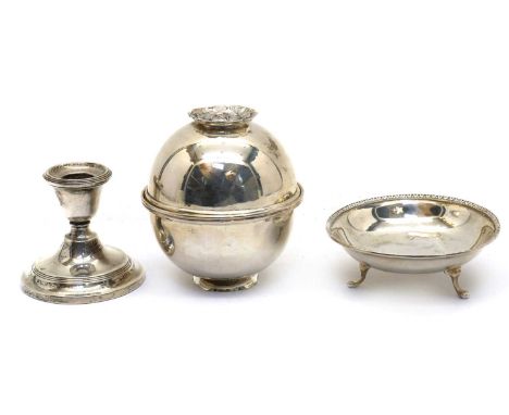 An Italian silver bowl and cover,20th century, with a gilded interior and a flower form foot and finial, 800 mark,10.5cm high