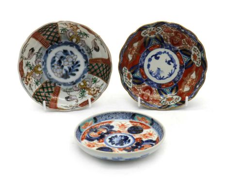 A collection of nineteen Japanese Arita dishes,19th-20th century, of lobed form, painted with three winter friends enclosed b