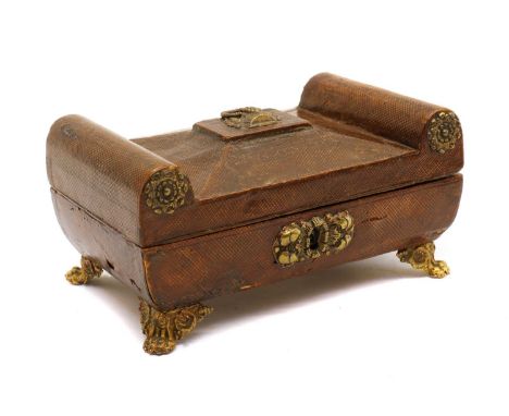 A Regency lacquered leather trinket box,c.1820s, of rectangular form, the lid with faceted sides and raised edges, throughout