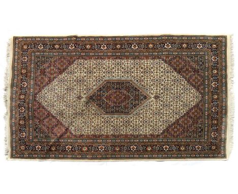 A modern Persian design carpet,on a beige ground with Herati motifs, 300 x 198cmCondition ReportSome staining to the edges. S