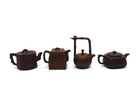 A collection of four Chinese Yixing zisha teapots,20th century, in various forms, including one with applied blossoming prunu