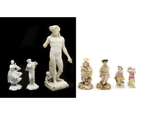 A group of continental porcelain figures, 20th century, comprising two Volkstedt figures, one of a piper, 15.5cm high and ano