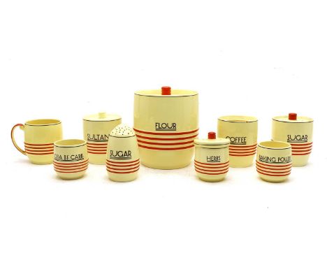 A collection of Mintons Art Deco porcelain kitchenware,each cream with red banding, most preserve jars with named sides, some
