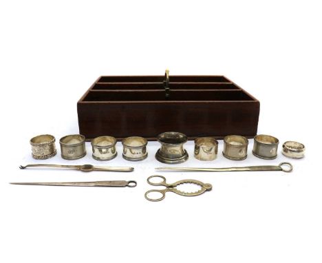 A collection of silver napkin rings, comprising an engine-turned pair by Mappin &amp; Webb Ltd, Birmingham 1915-1947, 4.5cm d