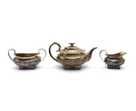 A composed George IV silver three piece silver tea service,the teapot by, Richard William Atkins & William Nathaniel Somersal