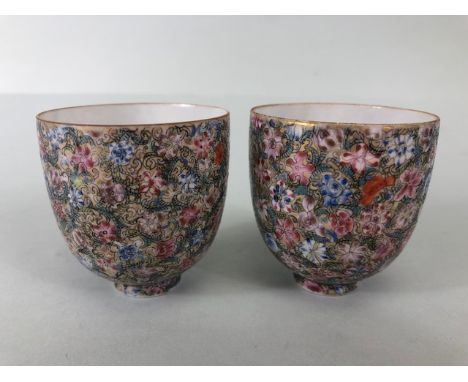 Oriental art, pair of Chinese egg shell porcelain tea bowls, beautifully decorated in millefleur design blue Qinlong seal to 