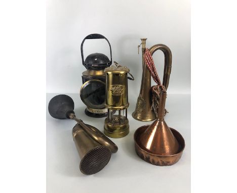 Brass and copper collectables to include a British rail signal lamp, miners lamp, car horn, bugle and a funnel 