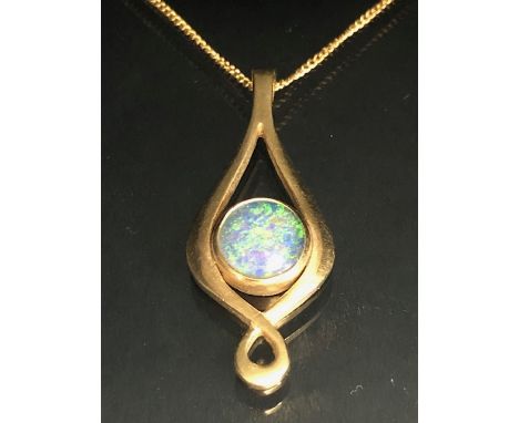 9ct gold twist pendant set with a black opal doublet, on a fine curb link chain approximately 4.02g total