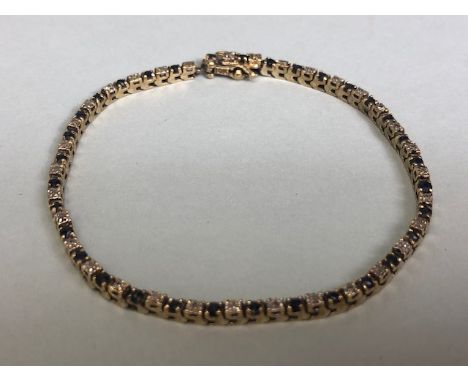 10k marked gold tennis bracelet set with alternate sapphires and diamonds approximately 64 stones, total weight approximately