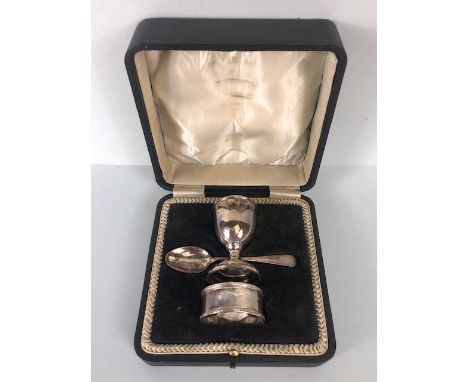 Hallmarked silver and boxed christening set comprising egg cup spoon and napkin ring 