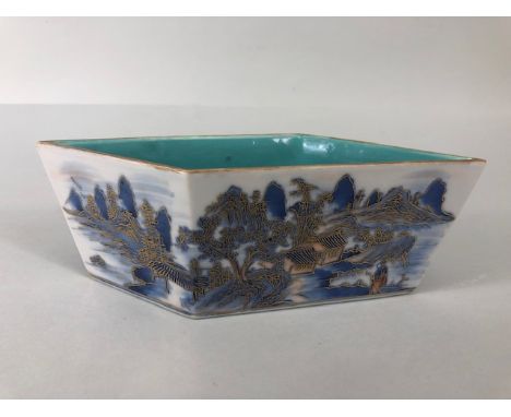 Oriental ceramics, Chinese brush wash pot of parallelogram form decorated with a village landscape in blue and white with gol