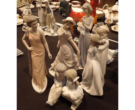 Seven Nao figurines of young girls