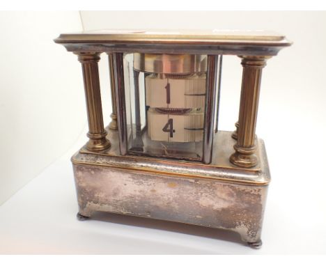 Early 20thC silver plated ticket clock CONDITION REPORT: Clock ticks when wound and tickets move, but we are unsure if the di