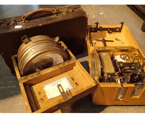 Two pigeon timing clocks and a vintage small case 
