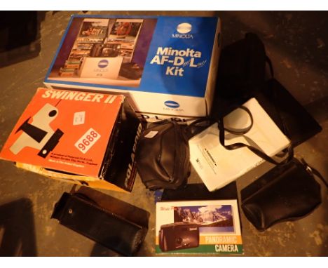 Box of compact cameras including Polaroid Swinger II 