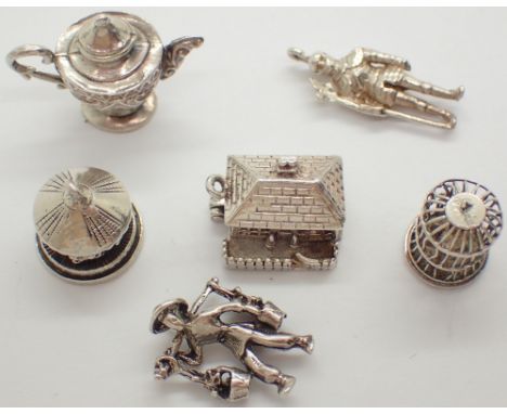 Six vintage silver charms