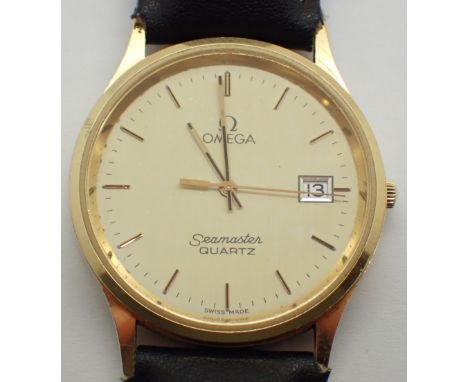 OMEGA 14K gold Seamaster quartz on a leather strap CONDITION REPORT: This item is working at lotting.
