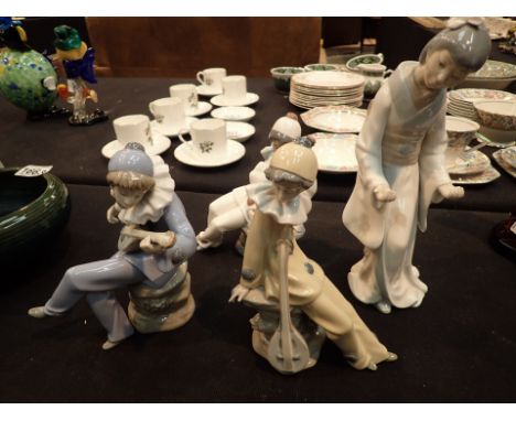 Four Nao figurines Geisha and three clowns with instruments A/F CONDITION REPORT: Geisha missing thimbles others appear undam