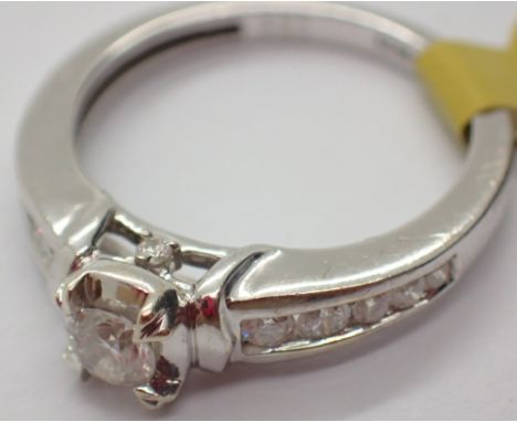 9ct white gold diamond solitaire ring with diamond set shoulders size J / K
