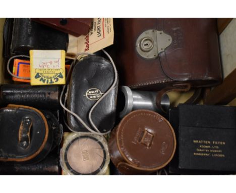 A box of camera and photography accessories including filters and light meters etc
